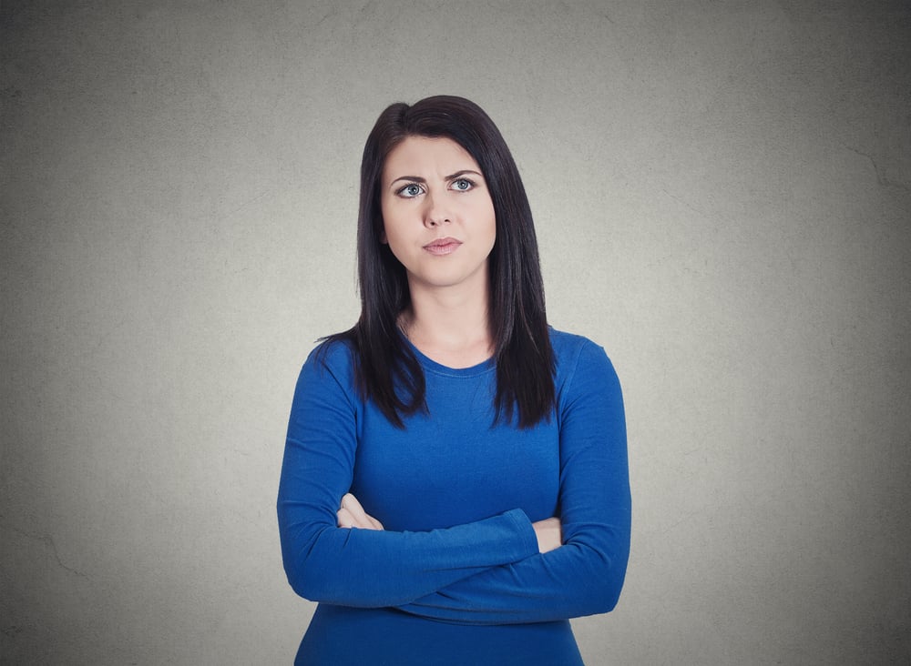 Closeup portrait grumpy annoyed, sad, unhappy, dissatisfied young woman, wife, employee, customer, isolated grey wall background. Human face expressions, emotions, reaction, attitude, perception-1