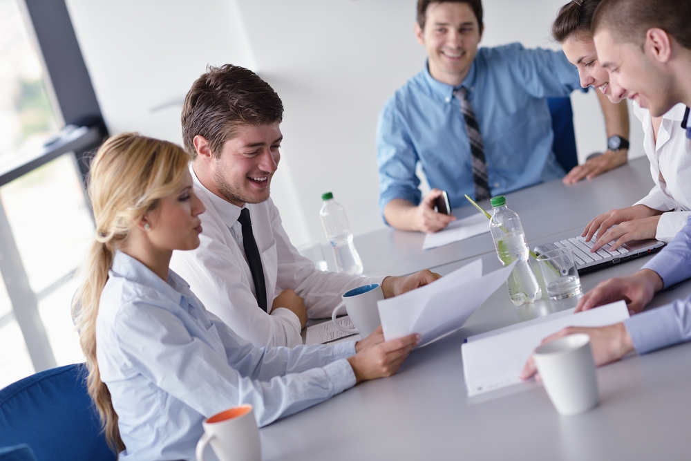 Group of happy young business people in a meeting at office-4